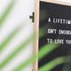 a sign that says a lifetime isn't enough to love you
