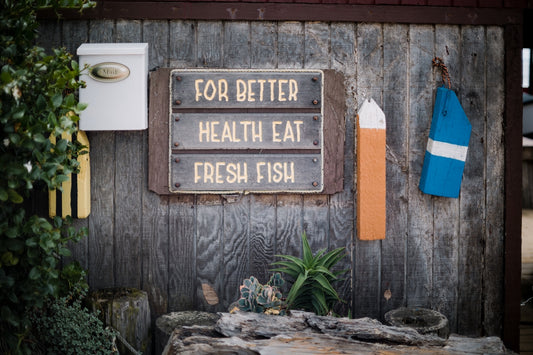 a sign on a wooden fence