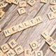 scrabble tiles spelling the word health on a wooden surface